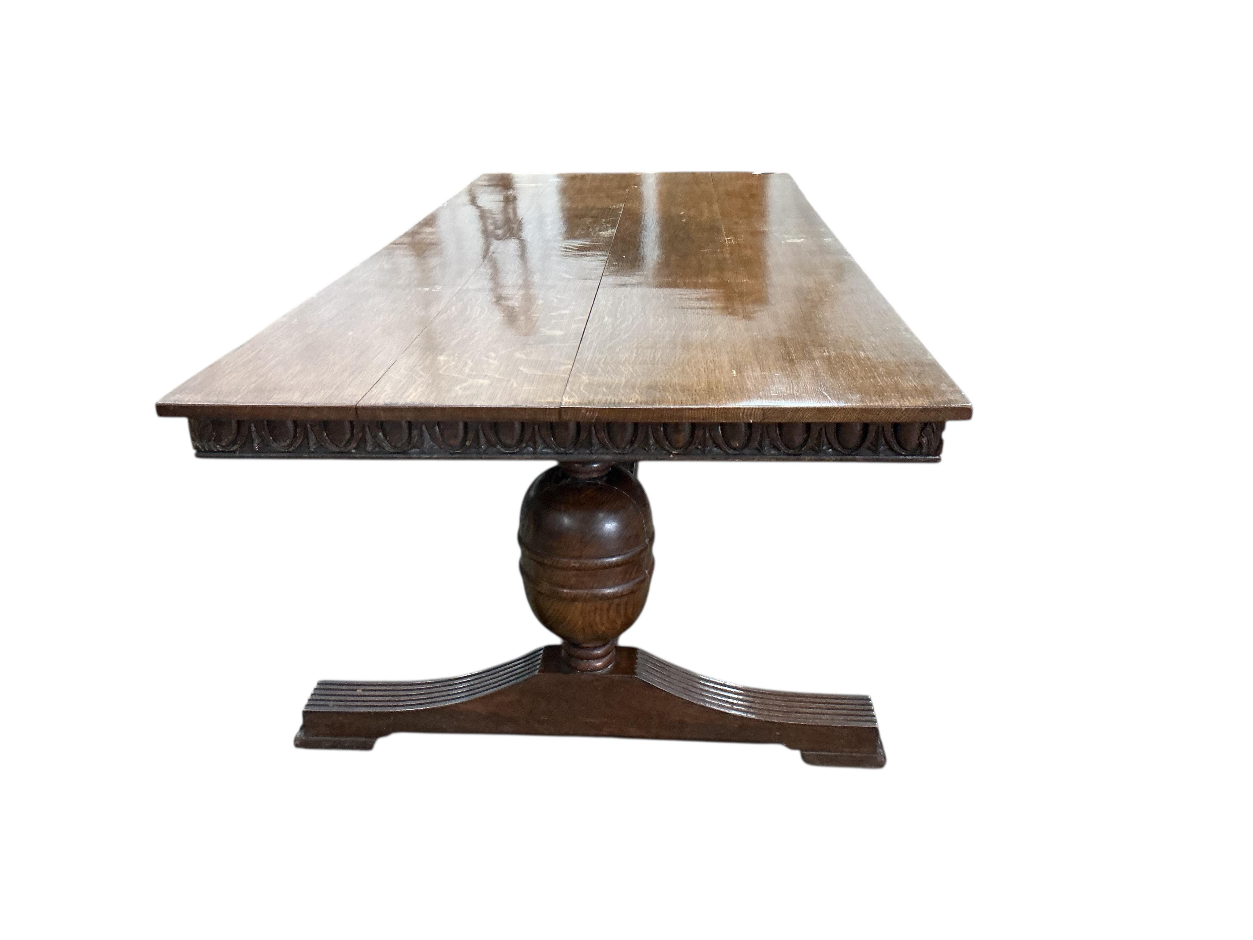 An 18th century style rectangular oak refectory dining table, width 243cm, depth 103cm, height 76cm